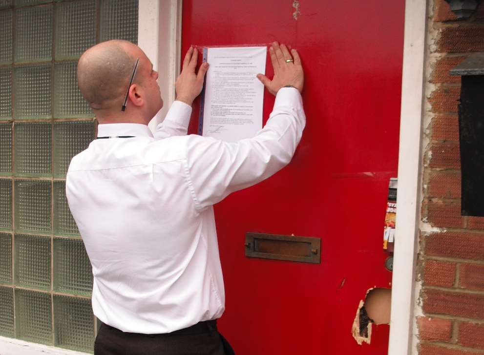 Notice is posted on the door of noisy student house