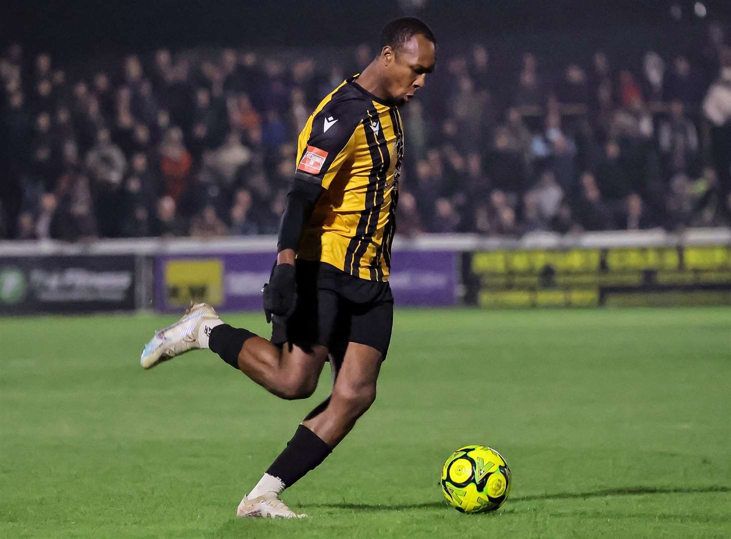 Folkestone defender Gavin Hoyte sends the ball forward. Picture: Helen Cooper