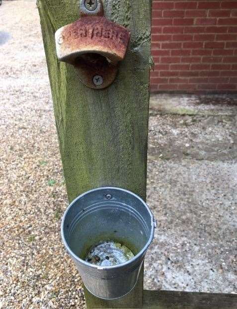 Simple and rusting, the wall-mounted bottle opener might be basic but it functions well and the tin pot I’ve added catches most caps