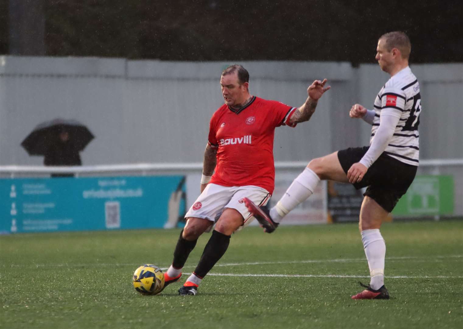 Chatham player-assistant Danny Kedwell is closed down by Margate striker Steve Cawley. Picture: Max English (@max_ePhotos)