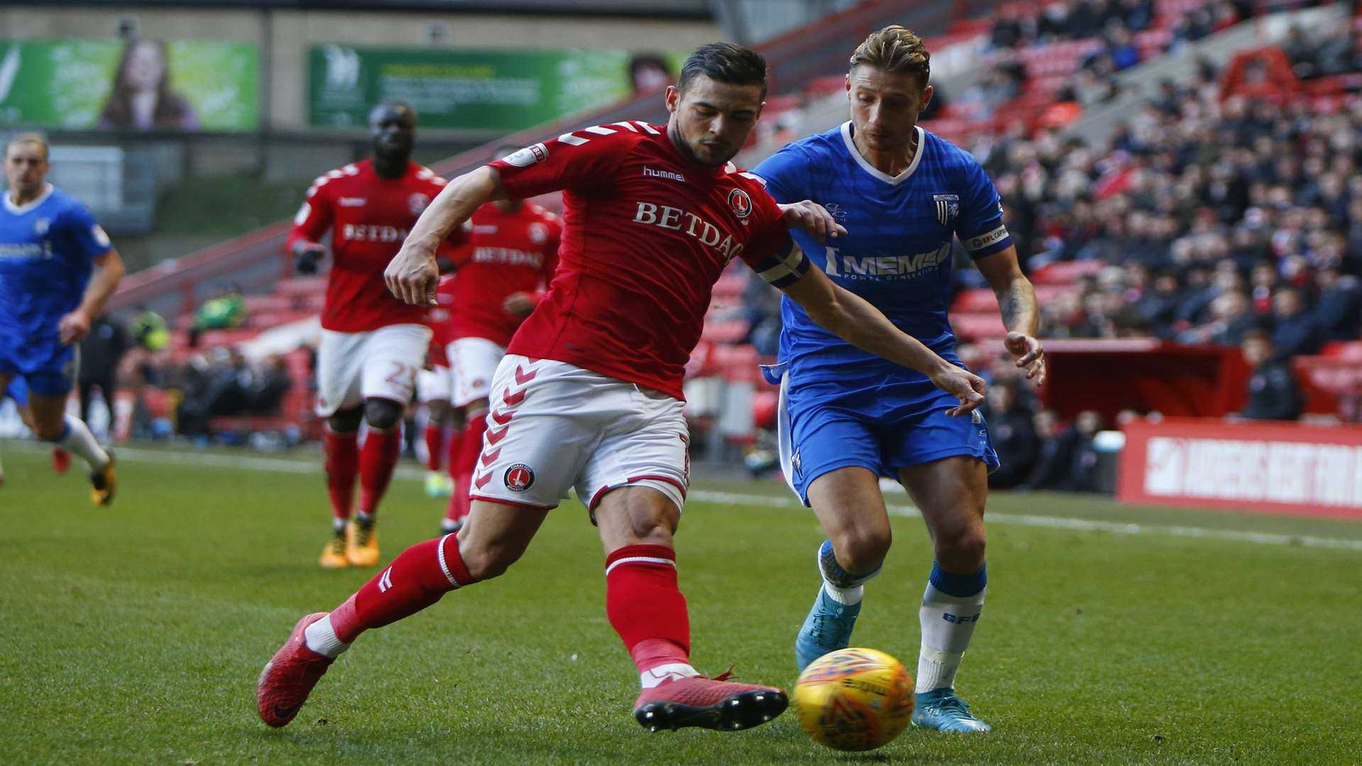 Gills skipper Lee Martin takes on Charlton's Jake Forster-Caskey Picture: Andy Jones