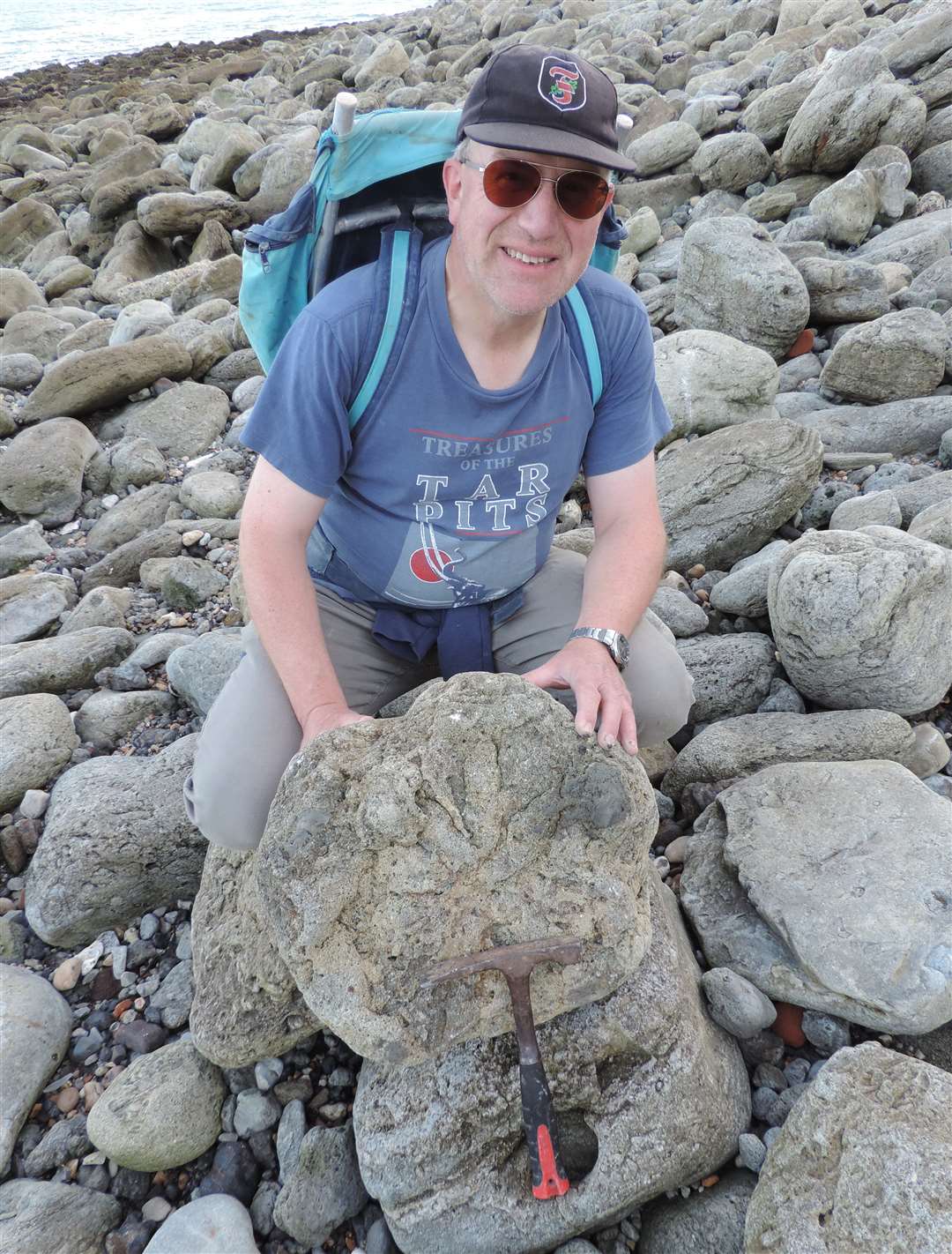 Steve Friedrich, local fossil collector, with his discovery.