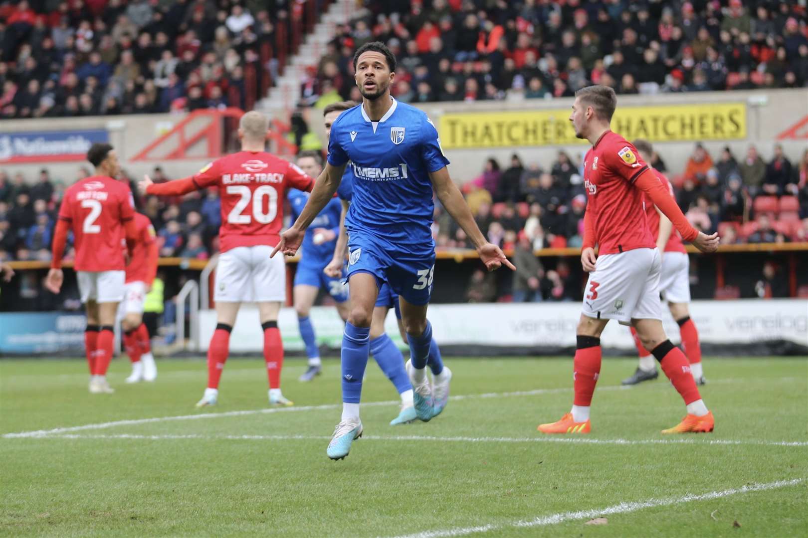 Timothee Dieng celebrates scoring Gillingham's equaliser in the first half