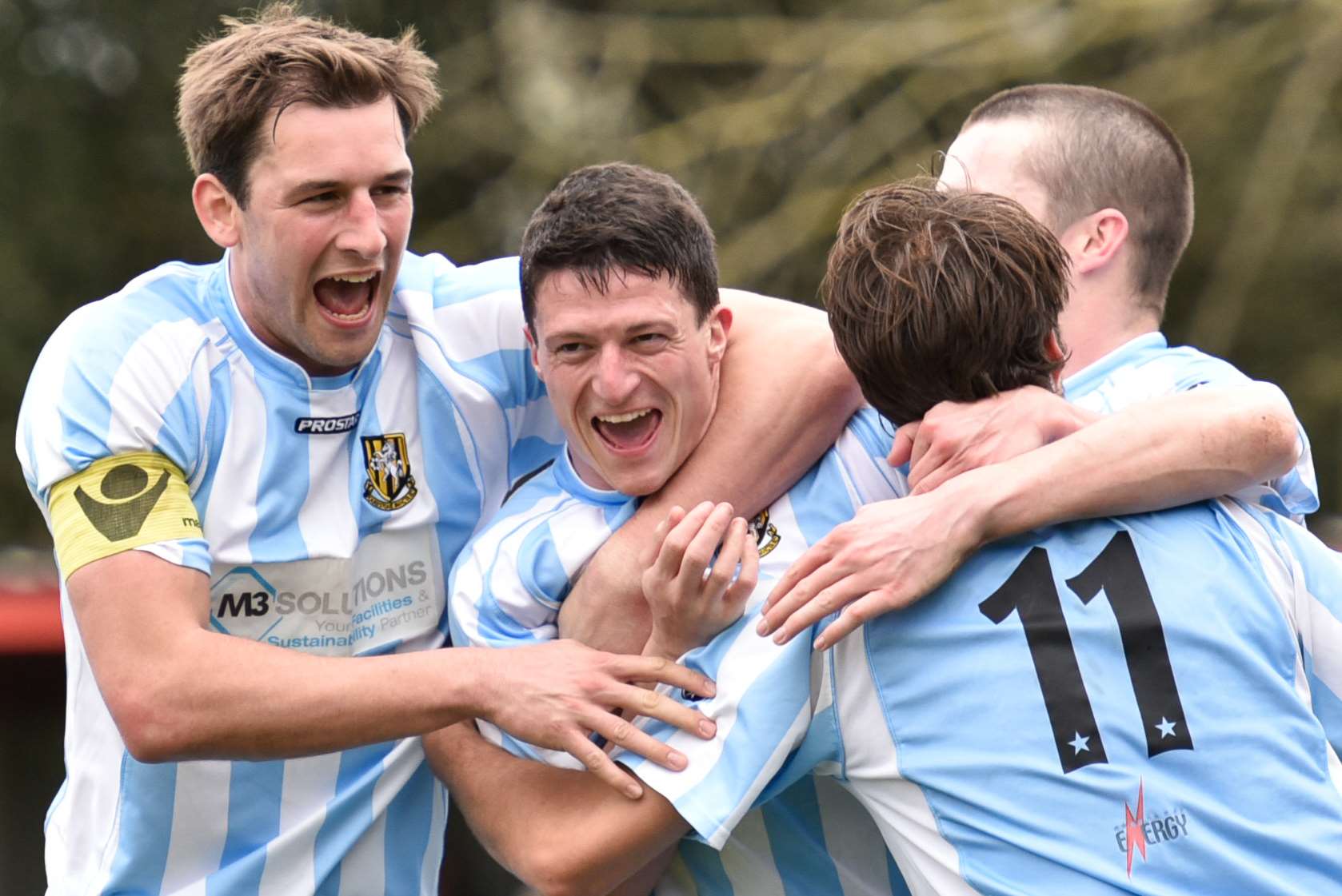 Centre-half Frankie Chappell (centre) celebrates scoring for Folkestone Picture: Alan Langley