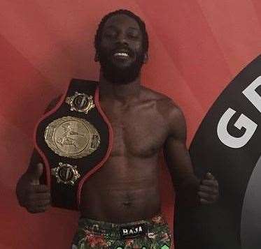 Chris Garnett, owner of Granite gym with his Flyweight championship belt