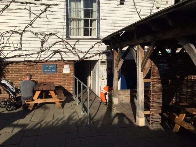 At the back of the pub there is a large outdoor area with covered seating to the left (complete with heaters) and picnic tables to the right. NB. Eagle-eyed readers will spot the hi-vis trousers making an entrance.