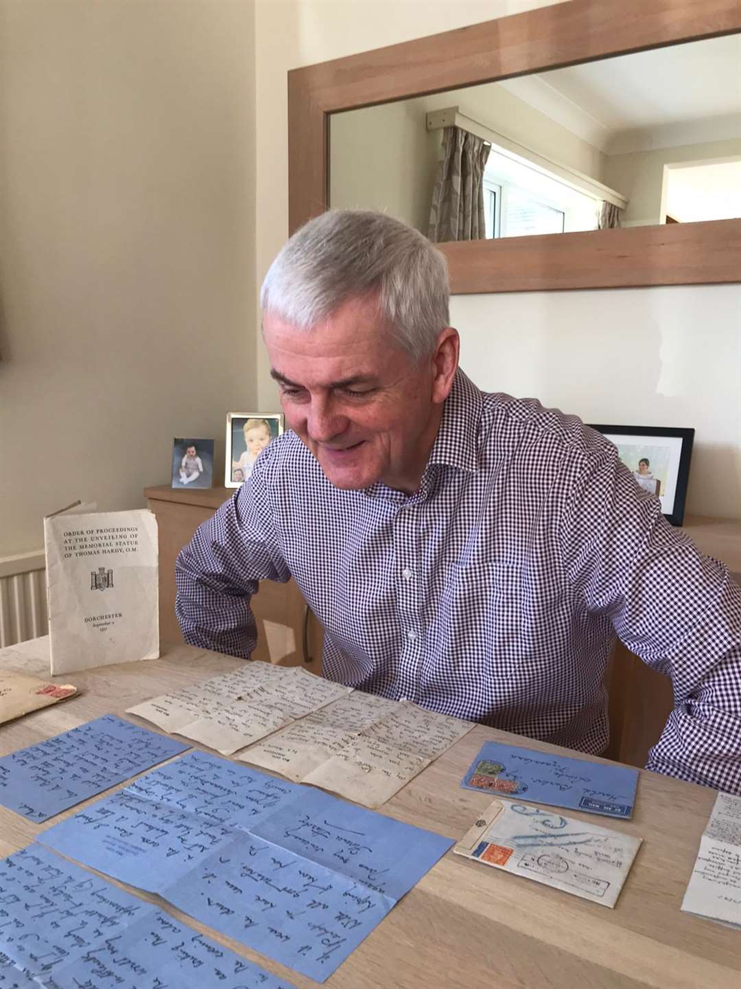 Ian Nicol reading the Thomas Hardy letters (Bridget Nicol/PA)