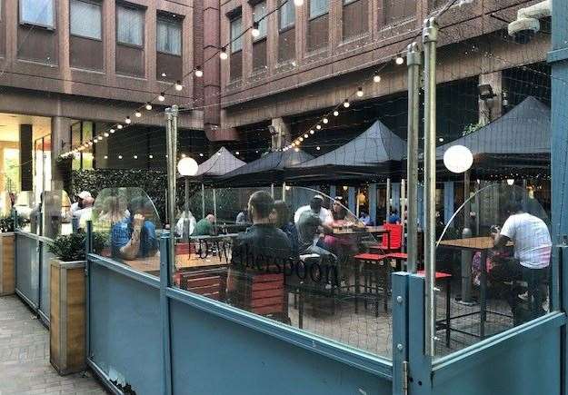 Drinkers using the outside area at the back of the pub are protected by nets on all sides and above