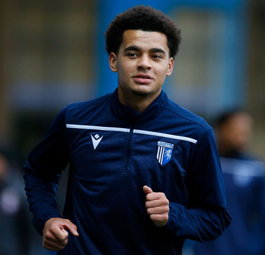 Gillingham's new loan signing striker Tom Dickson-Peters warms up ahead of his introduction at half-time. Picture: Andy Jones