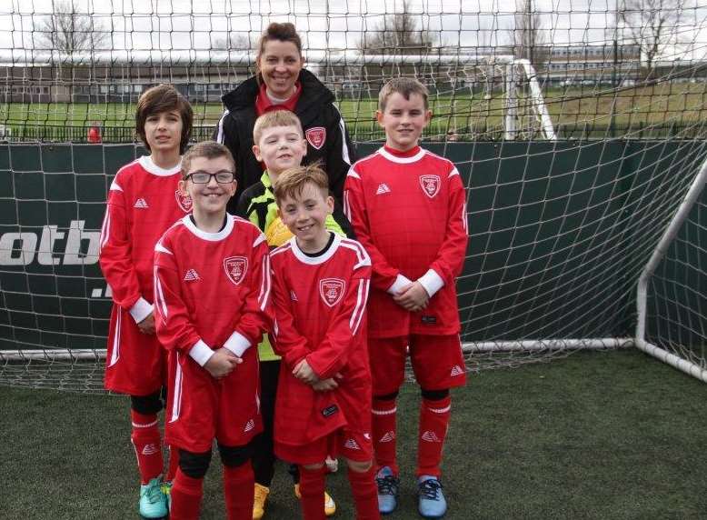 The Dolphins are, back row, Antonio, 10, Thomas, nine,and Liam, nine, and front row, Jake, nine, and Sonnie, eight. Pictured with manager Joanne Hiscock