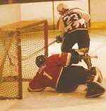 THWARTED: Phil Chard is stopped by the visitors' netminder Moore. Picture: ANDREW WARDLEY