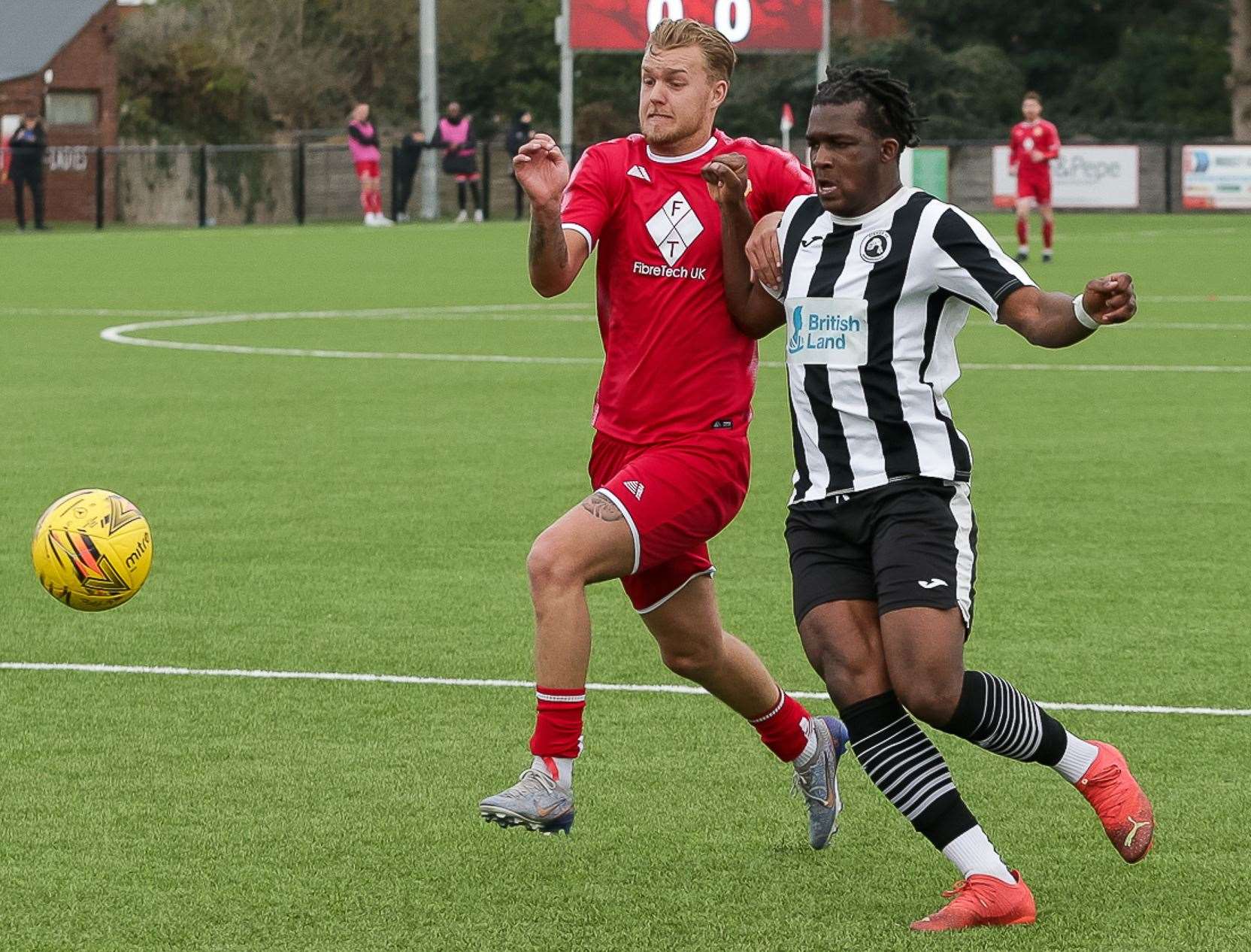 Whitstable striker James Jeffrey challenges with a Fisher player for the loose ball. Picture: Les Biggs