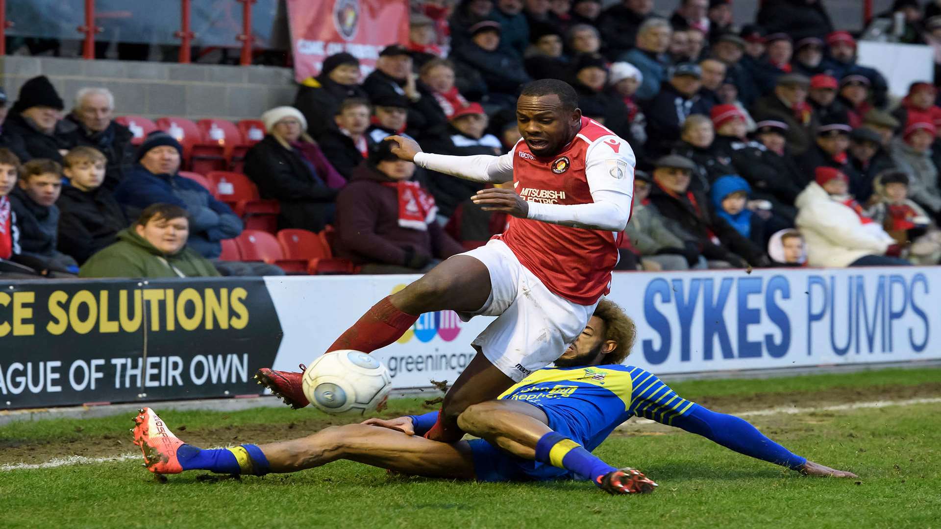 Myles Weston is taken out near the touchline Picture: Andy Payton