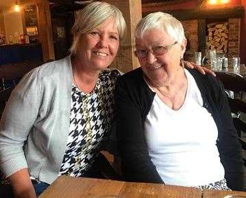 Ann Capel, left, presented flowers, money and card to Jean