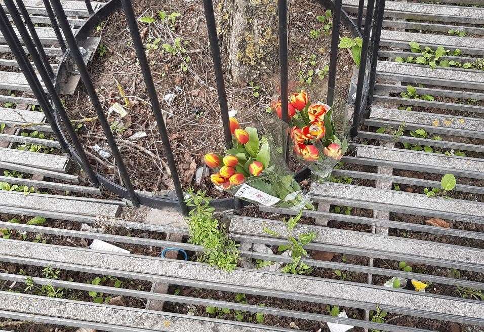 Floral tributes left to an elderly woman who died following a crash at Chatham Waterfront bus station