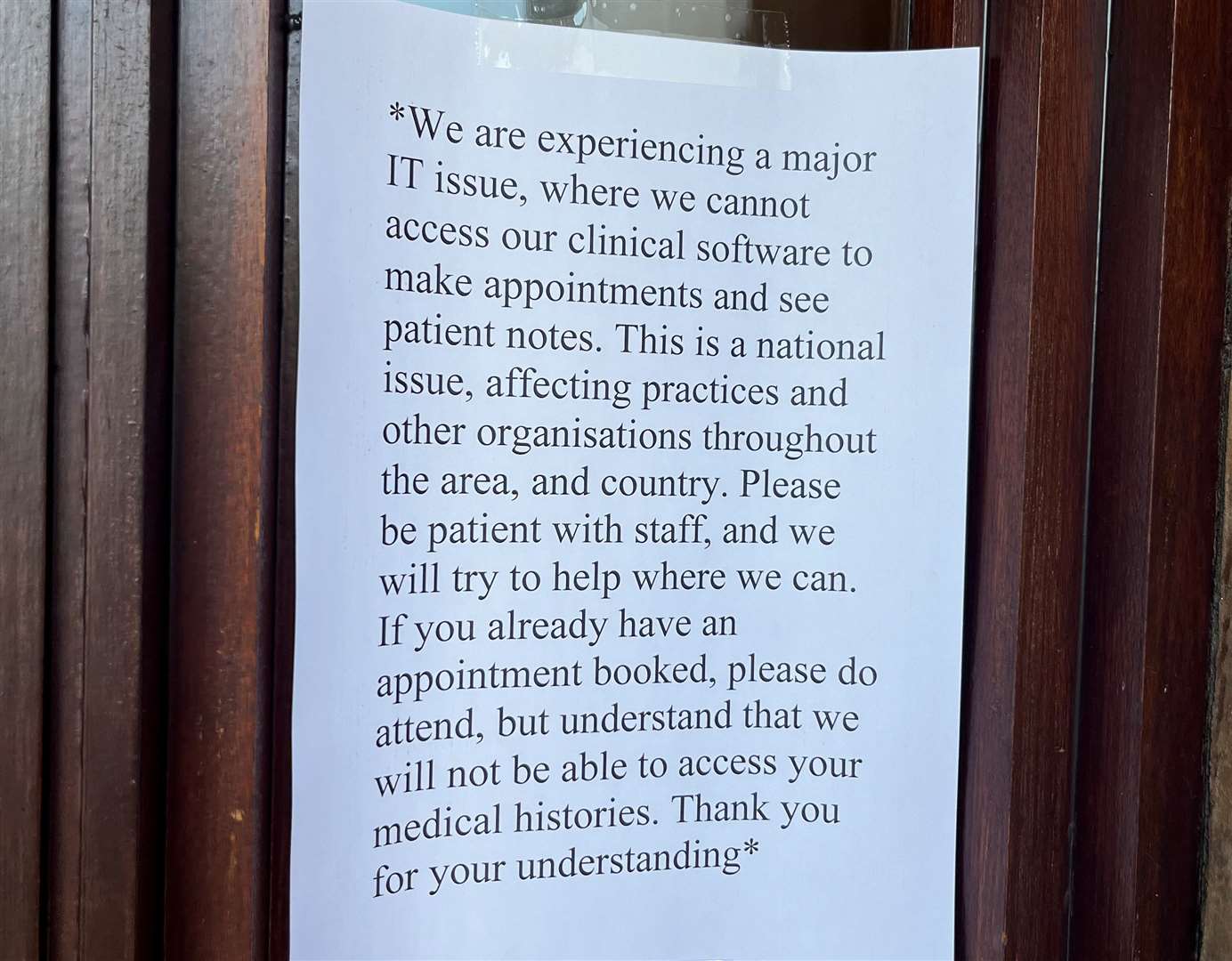 A sign warning patients of the issues at Elmdene Surgery, in London Road, Stone