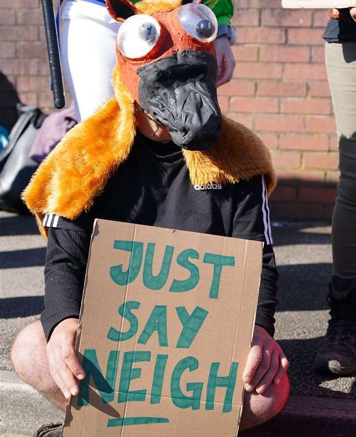 An activist outside the gates ahead of day three of the Randox Grand National Festival at Aintree Racecourse. Picture: Peter Byrne/PA