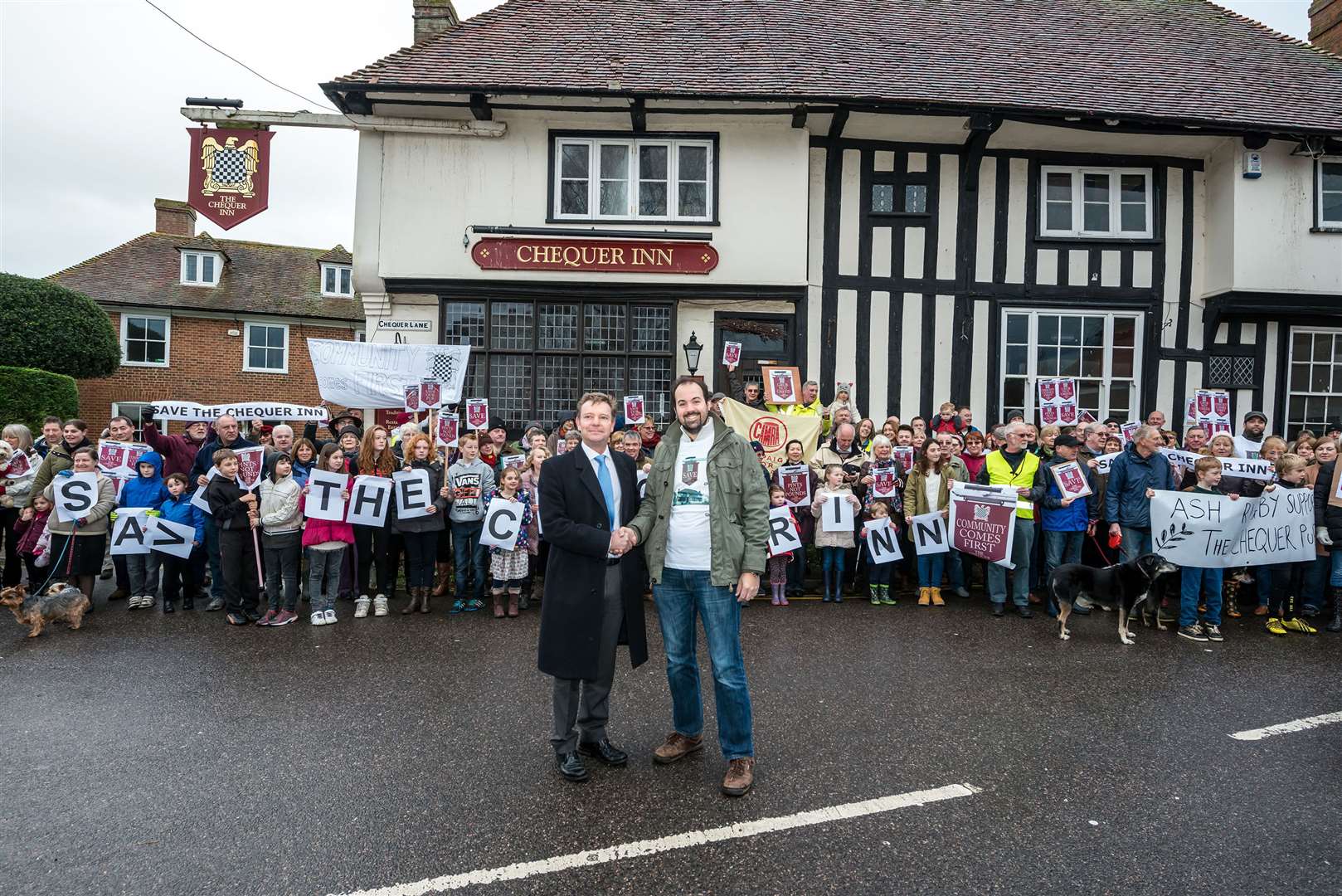 Campaigners outside the Chequer Inn in Ash, which they would like to keep as a pub