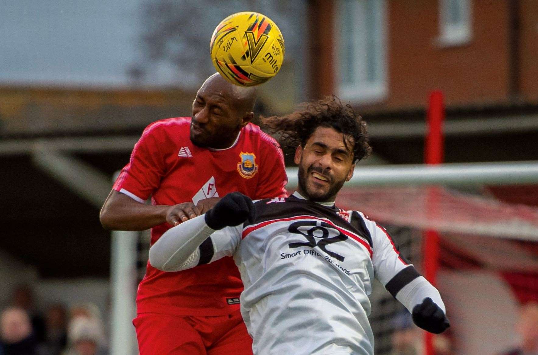 Whitstable defender Jahmal Howlett-Mundle comes up against Faversham striker Stefan Payne. Picture: Ian Scammell