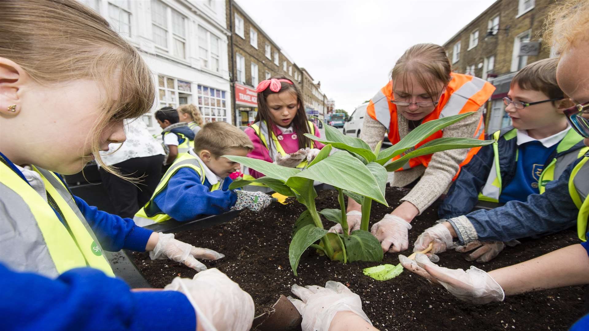 Volunteer Jemma Dudley and pupils from St Edwards Primary School