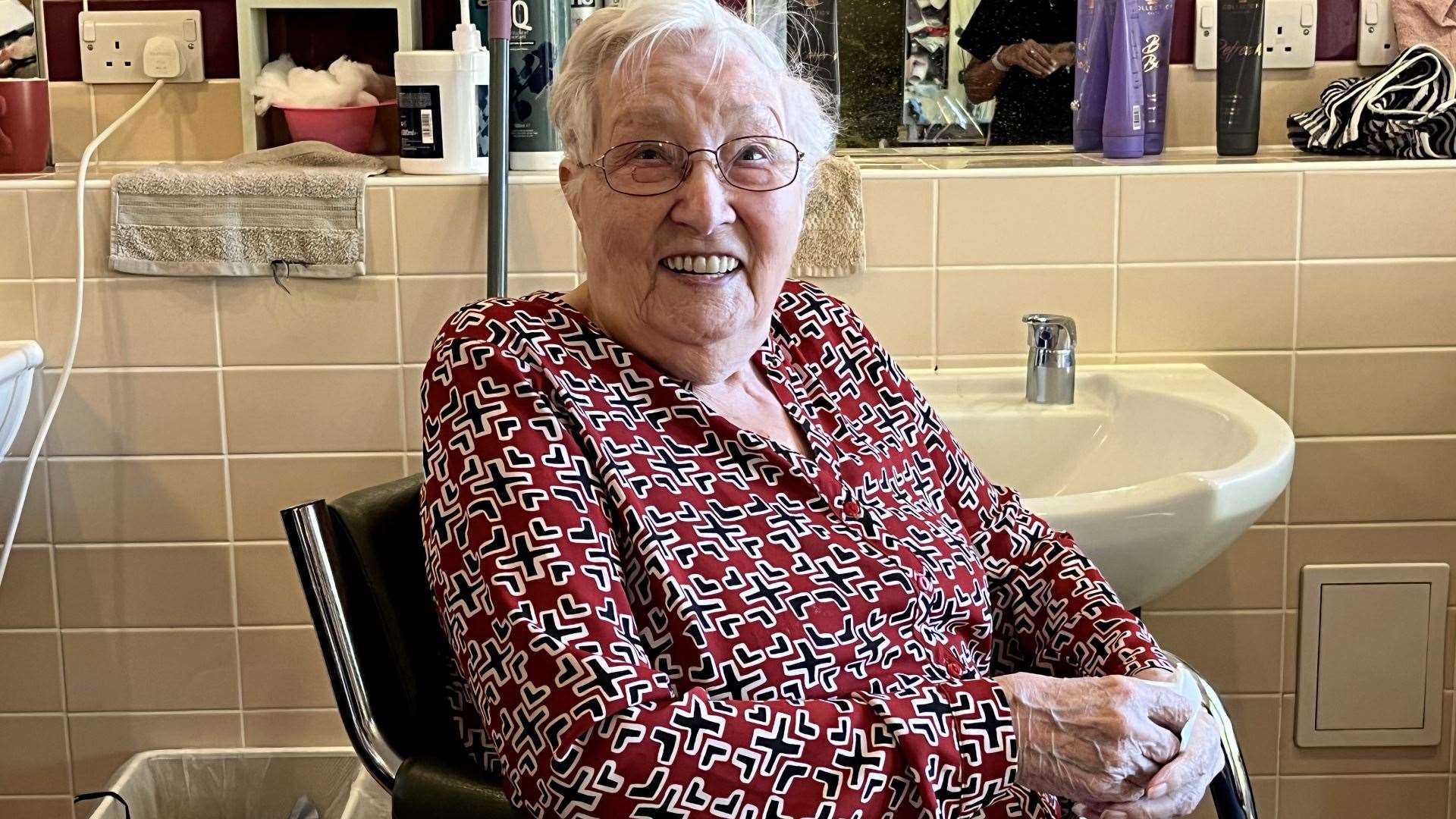 A resident at the salon getting a trim