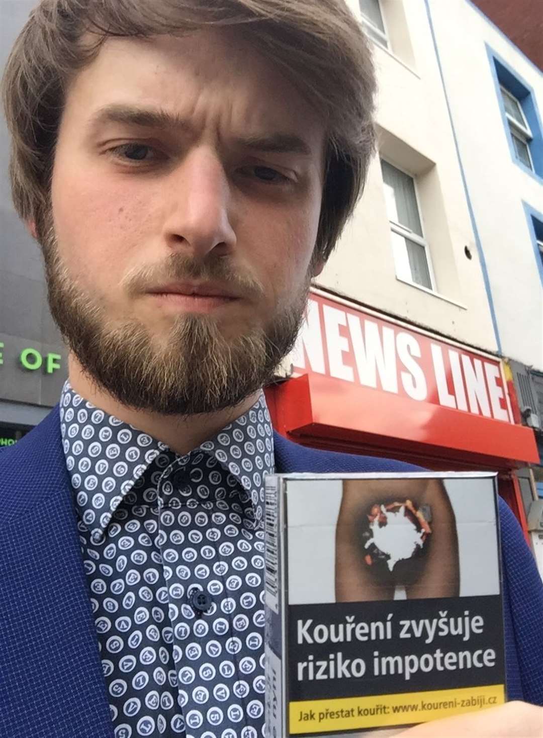 Brad Harper with cigarettes bought at Newsline