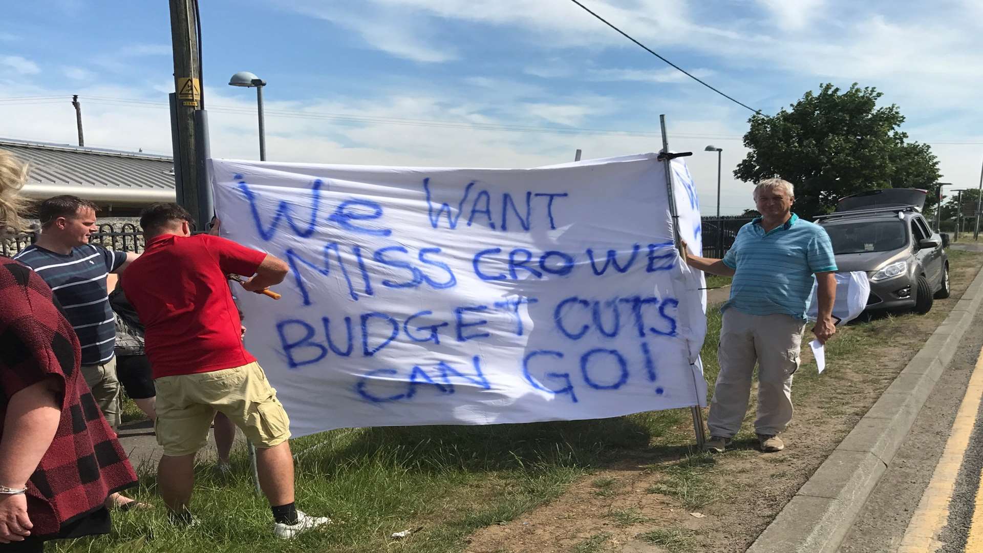 "We want Miss Crowe. Budget cuts can go!" Parents protest over cuts by governors outside Leysdown primary school