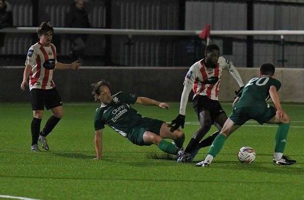 Canterbury City midfielder Dan Lawrence, back on the field after his caretaker stint in charge alongside Sam Wilson, gets stuck in during last Tuesday's 1-0 loss at Sheppey. Picture: Marc Richards