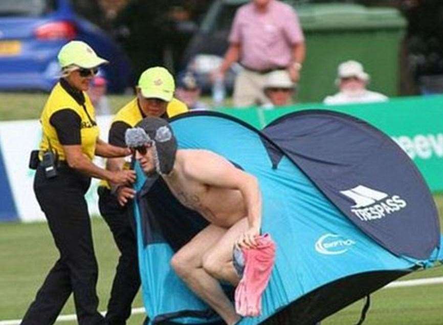 Lee Marshall is escorted off the field by security. Pic: @ESPNcricinfo