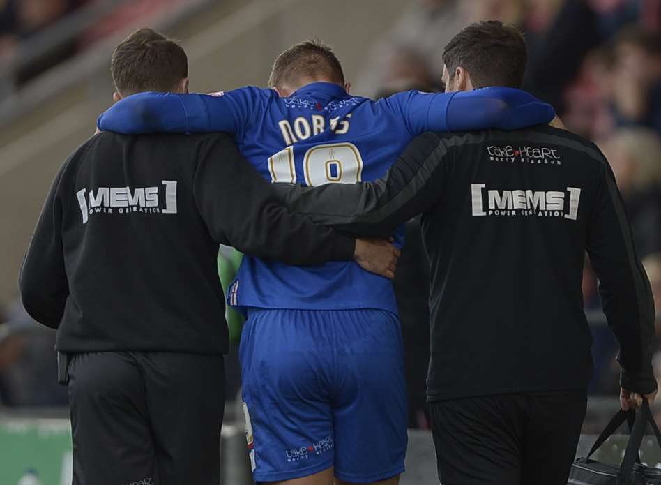 Luke Norris leaves the field injured at Crewe and, along with Cody McDonald, is struggling to be fit ahead of Gills' home double header this week Picture: Barry Goodwin