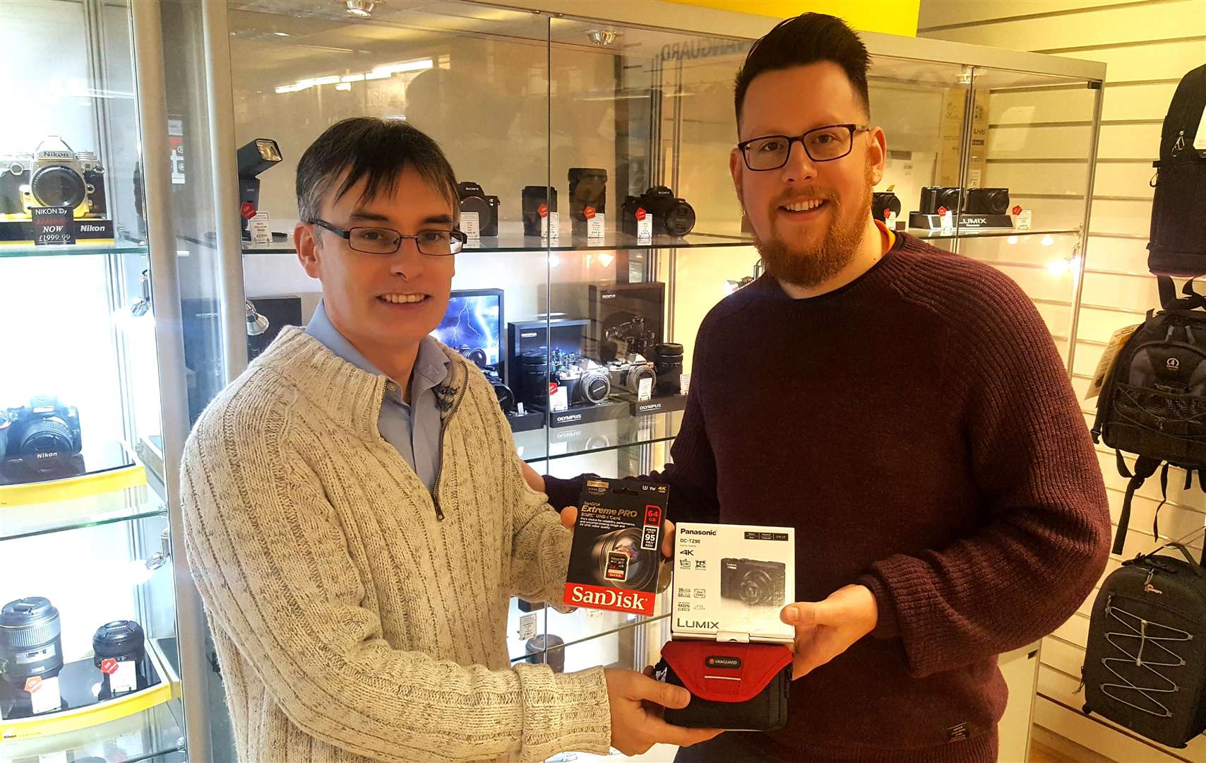 Yan Cowley (left) of the Canterbury Camera Centre presents the prize Panasonic Lumix to winner Daniel Russell