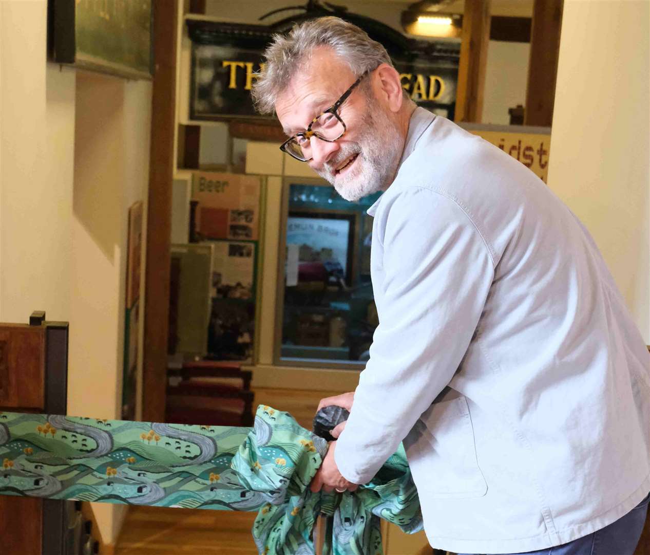 Hugh Dennis cut a ribbon to open the Lives in Our Landscape Gallery not with a pair of scissors but with a replica stone age flint