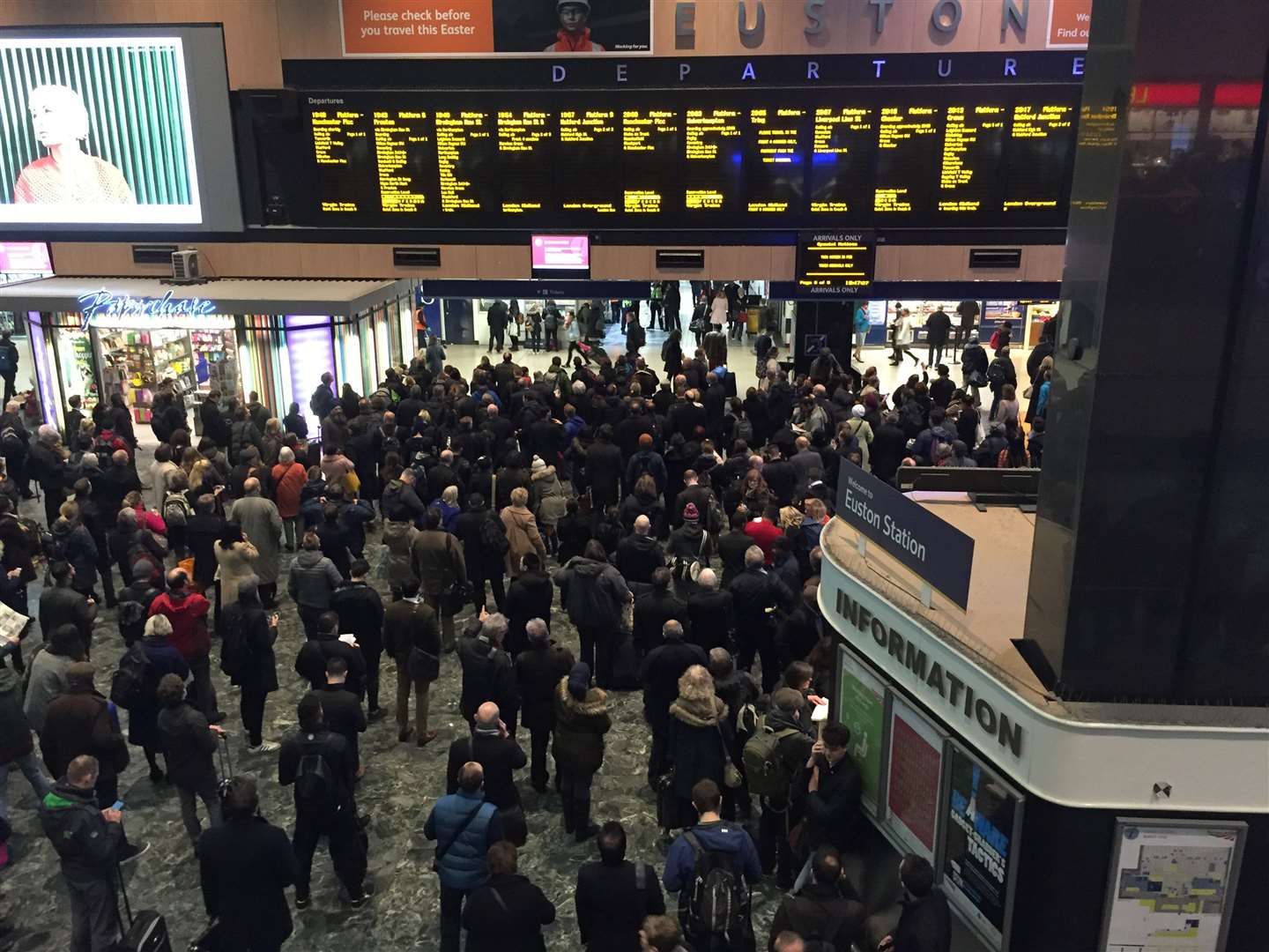 Passengers crowd the concourse at Euston station (Sally Wardle/PA)