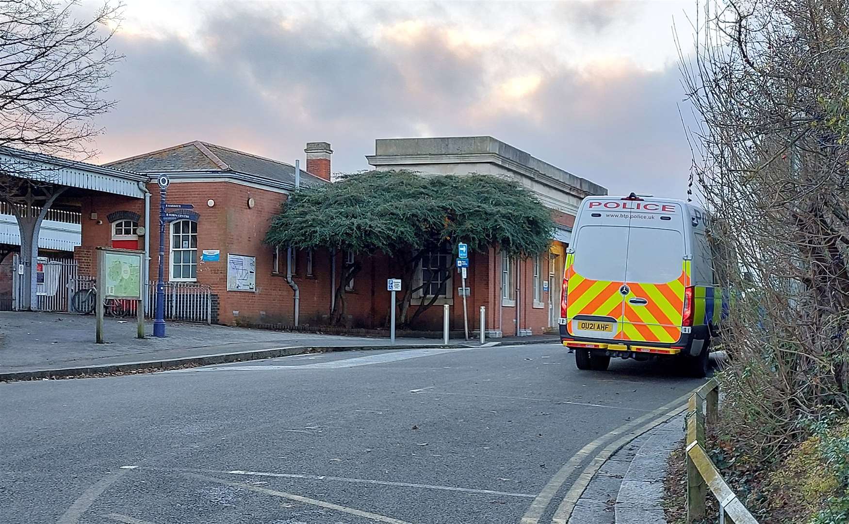 Police remain outside Whitstable train station this afternoon following the early morning incident