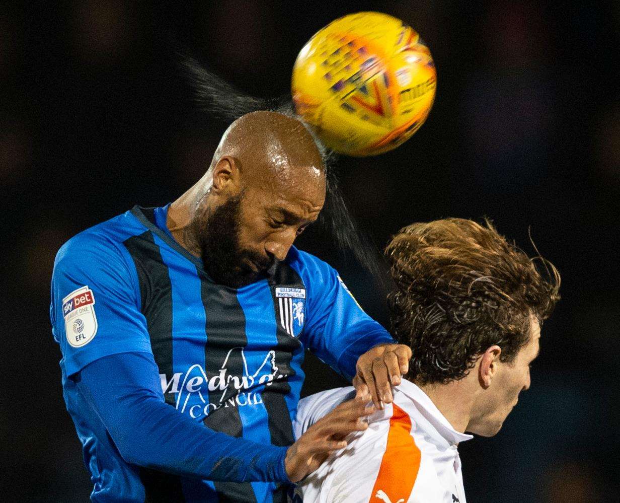 Josh Parker heads the ball ahead of Glen Rea Picture: Ady Kerry