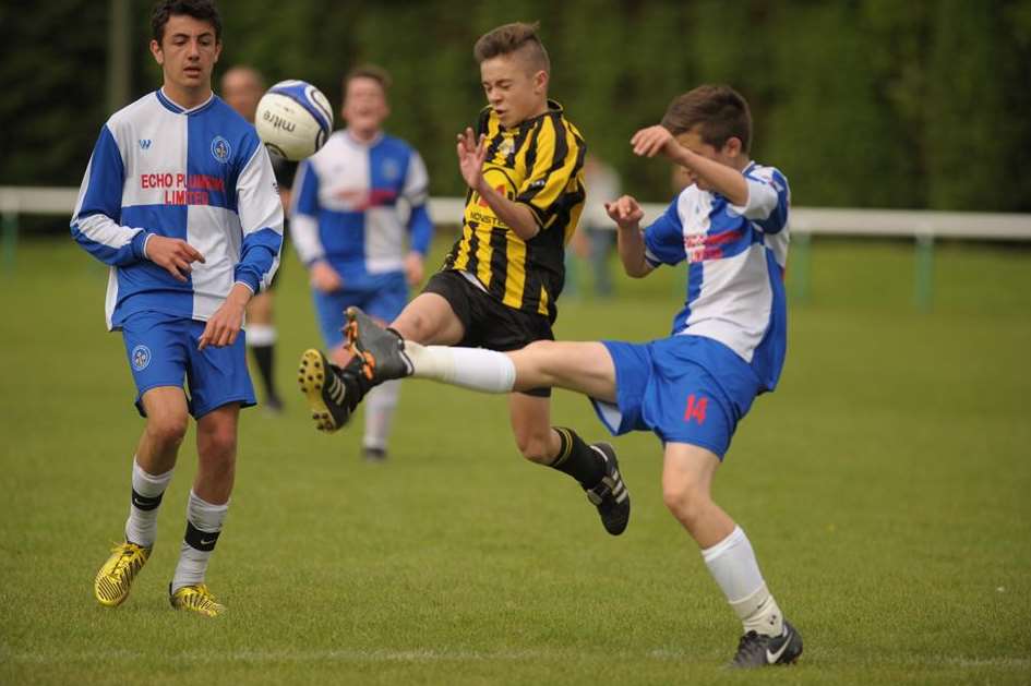 Bredhurst Juniors (blue) battle it out with Rainham Eagles in the Under-14 League Cup final. Picture: Steve Crispe