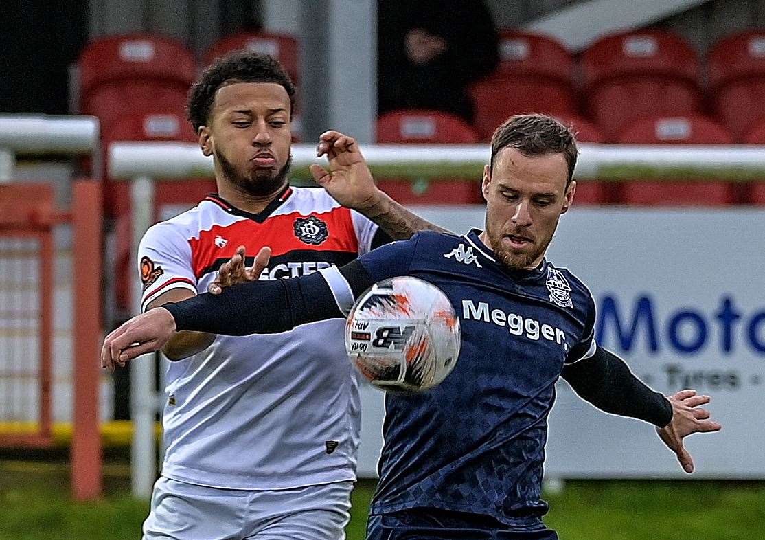 Jordan Higgs battles an away player for the ball. Picture: Stuart Brock