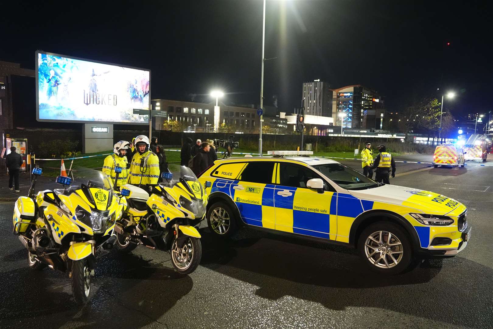 Several police vehicles outside the bus station (Andrew Milligan/PA)