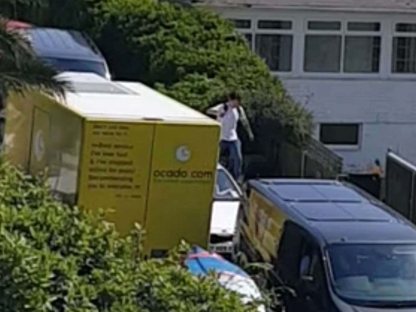 A pedestrian has to walk on a wall on The Edge to get past stuck traffic. Picture:Jenny Whitaker