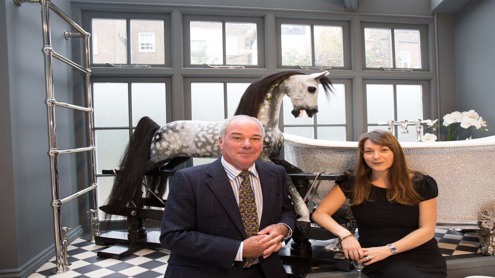 Marc Stevenson, one of Crystal, the rocking horse's creators with Ria Rendo-Castro, of Catchpole and Rye, who have made a crystal encrusted bath