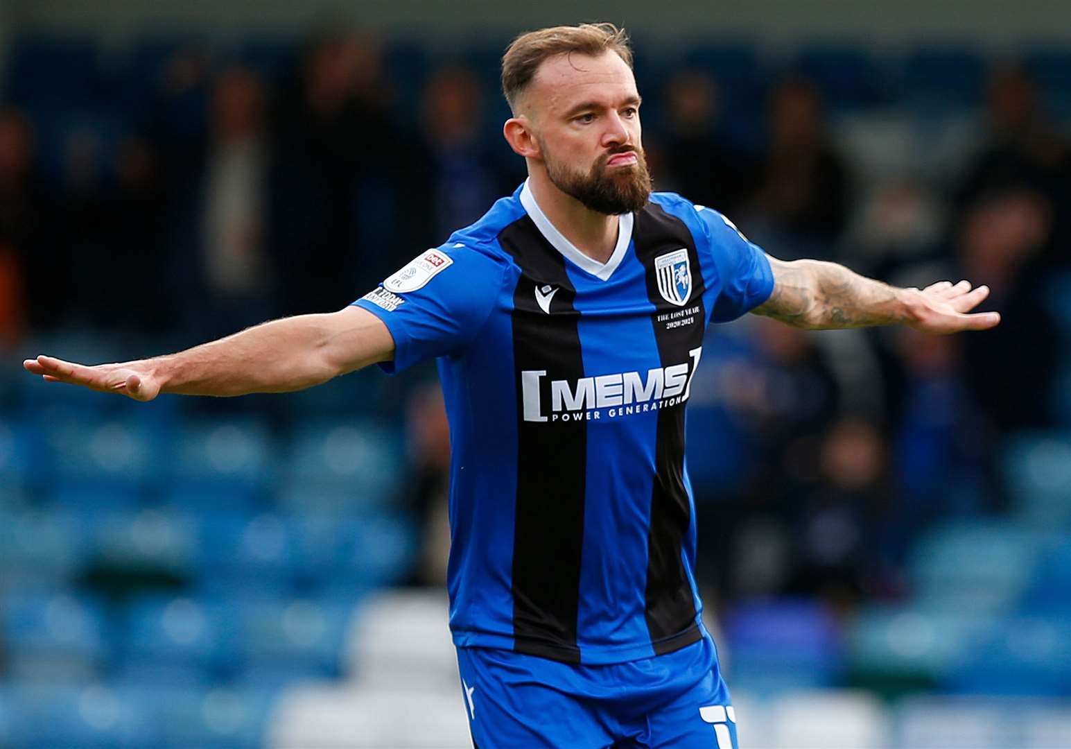 Gills midfielder Danny Lloyd celebrates opening the scoring from the penalty spot. Picture: Andy Jones