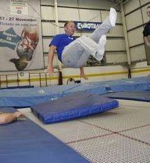 Kat Driscoll shows Alex Hoad how to trampoline.