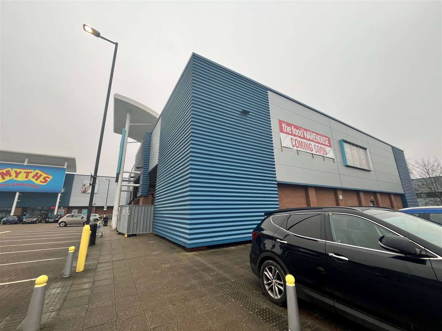 A sign saying ‘The Food Warehouse coming soon’ is displayed on the side of the store