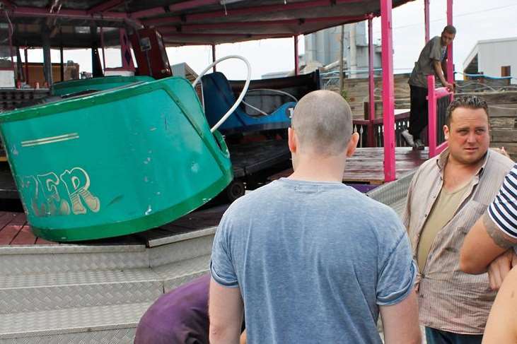 Crowds around the derailed Waltzer ride