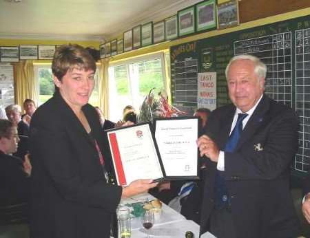 Lorraine Dagger receives the award from Mike Newsom. Picture: BRIAN CUMMING