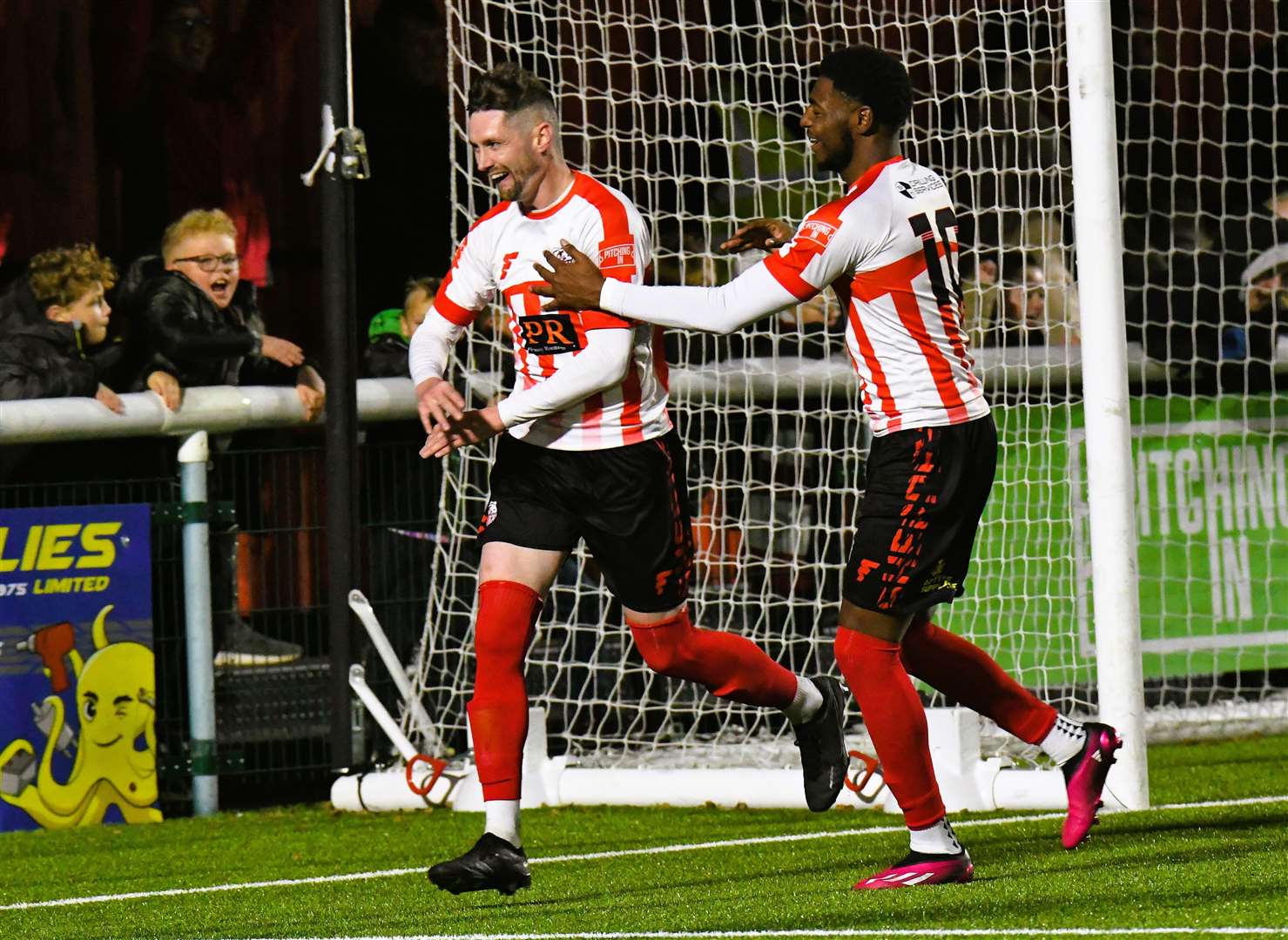 Two-goal Dan Bradshaw celebrates with Javaun Splatt after scoring the third goal in last Saturday’s 3-0 league win over East Grinstead Picture: Marc Richards