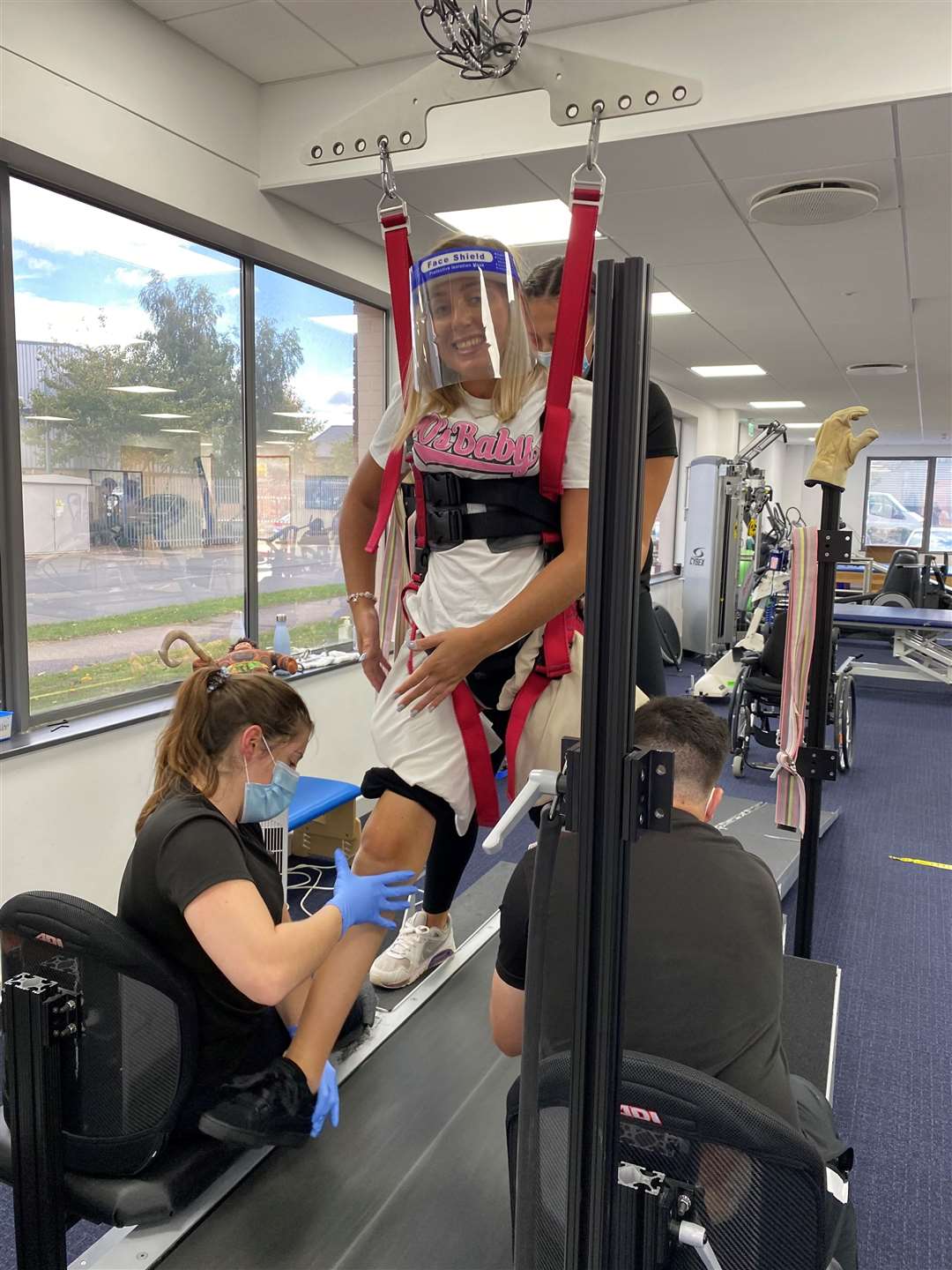 Hayley Bray takes her first assisted steps on a treadmill as part of her ground-breaking rehabilitation Picture: Action Group