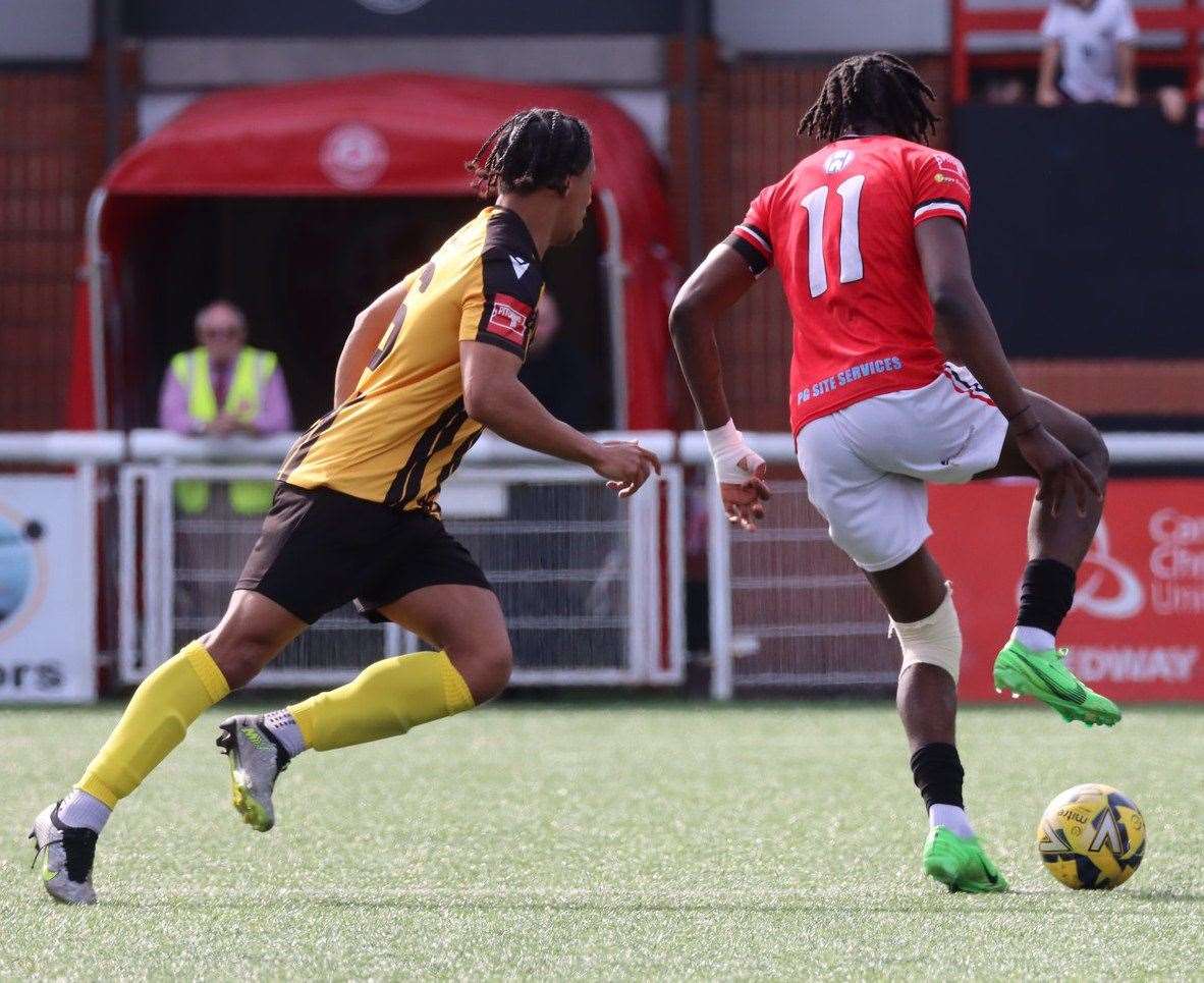 Jamie Yila, of Chatham, is closed down by Folkestone's Jordan Ababio in midfield. Picture: Max English (@max_ePhotos)