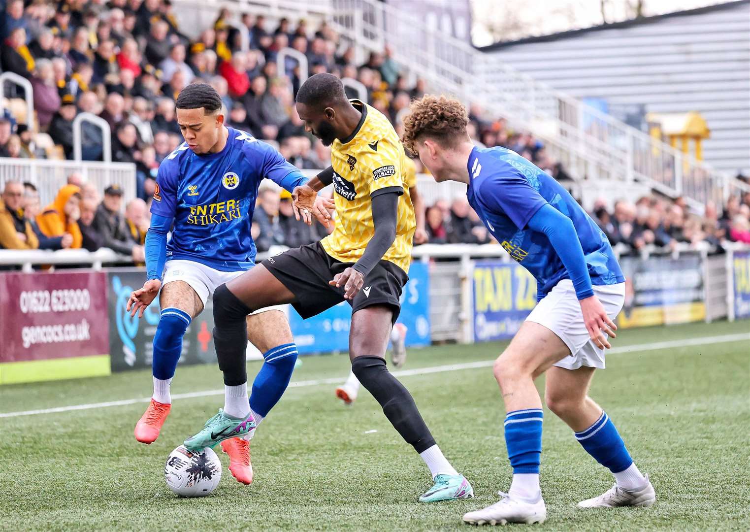 Mo Faal tries to escape the attention of two St Albans defenders. Picture: Helen Cooper