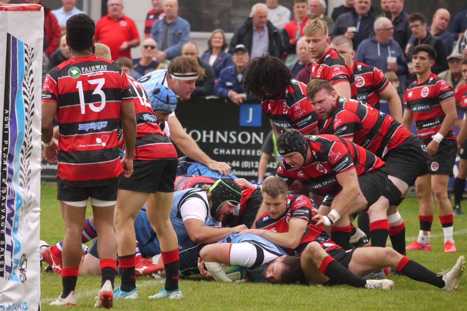 Desperate defending between Tonbridge Juddians (red) and Birmingham Moseley